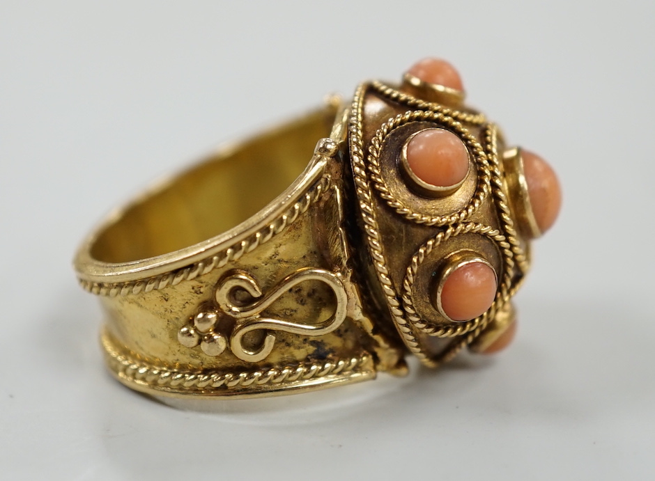 A 20th century yellow metal, coral bead and cannetile work set dress ring, size N/O